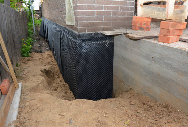 Happy homeowners after waterproofing job in Pershing